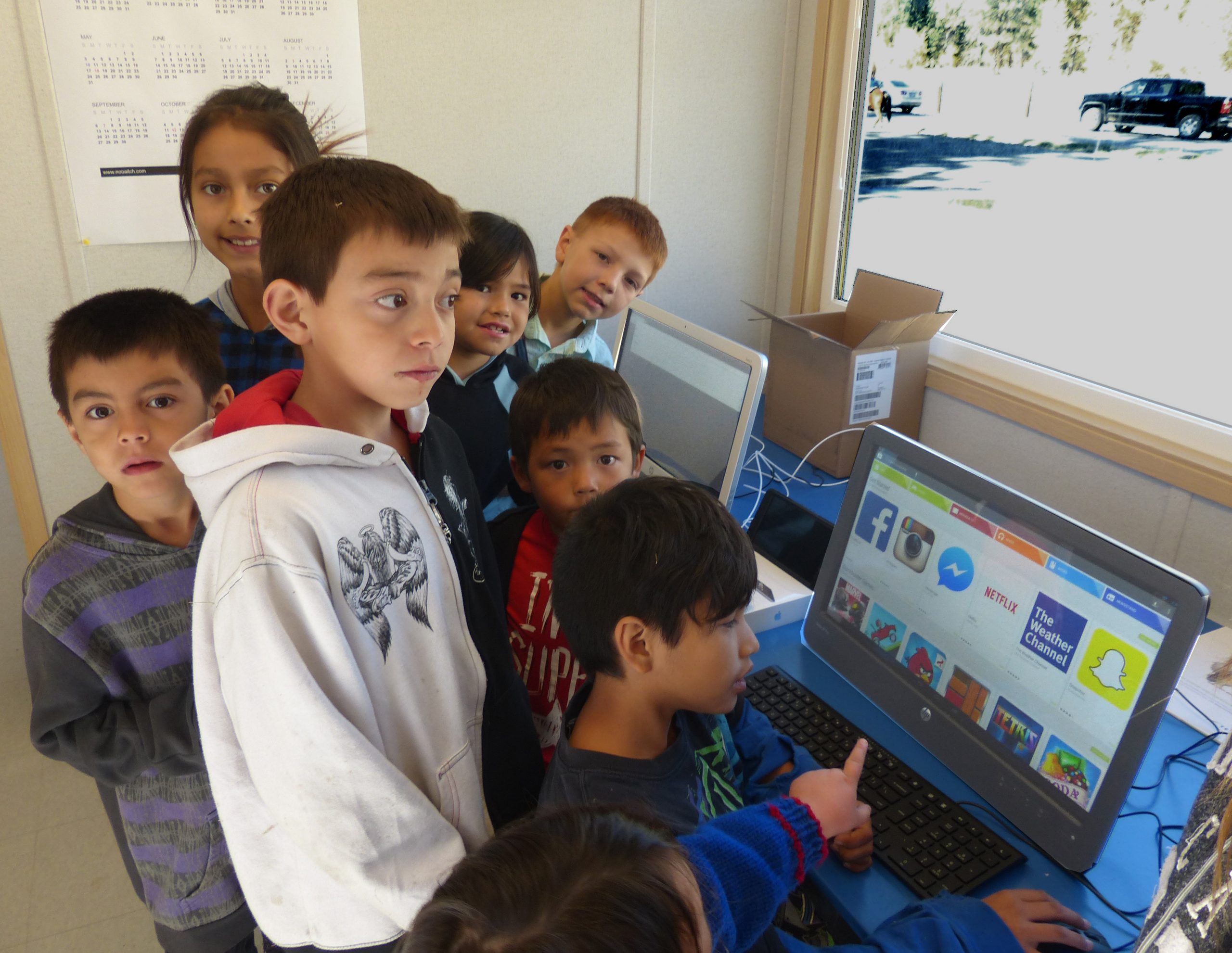 Children with the computers in their learning centre.