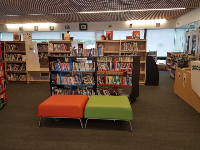 Seats and shelves of books at the Lax Kw'alaams library and learning centre.