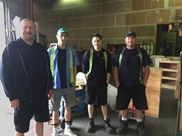 The loading dock and crew at Bandstra Transportation that ships shelves to Write to Read BC libraries.