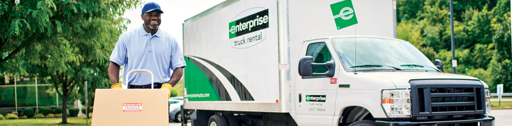 Enterprise Rentals banner: a man carting a box, beside a cube van. Its contributions toward our projects puts Enterprise among the Write to Read BC sponsors.