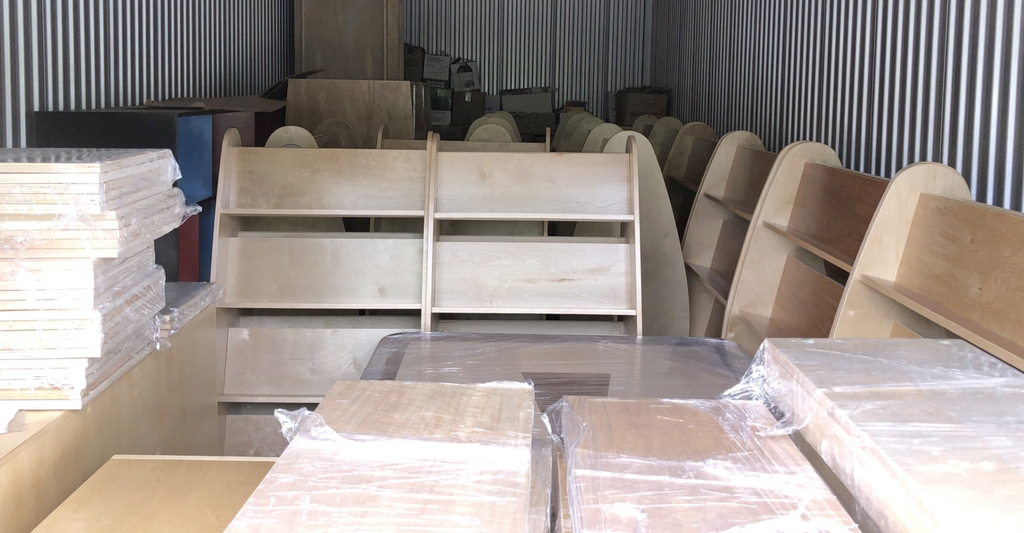 At the ''distribution centre'' in Nanaimo, shelves made at Nanaimo Correctional Centre await instllation in the next library.